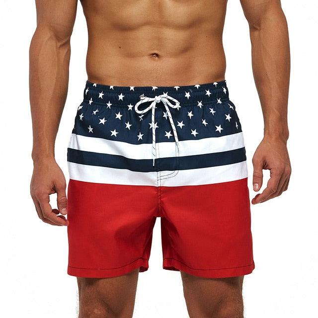 Men's boardshorts with starry navy top, white stripes, red bottom, quick-dry mesh-lined trunks on Tampa Home & Garden Store