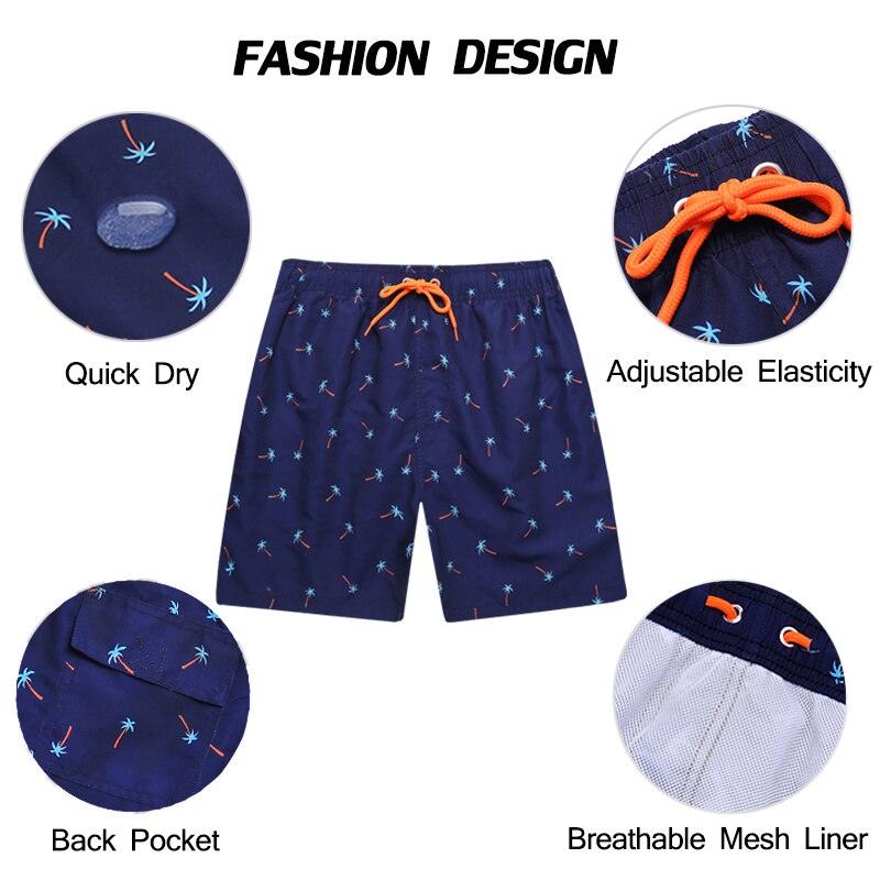 Men's navy palmprint swim shorts with orange drawstring and quick-dry liner back pocket on Tampa Home & Garden Store