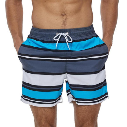 Stevvex men's quick-dry striped boardshorts with blue gray white bands and elastic drawstring on Tampa Home & Garden Store