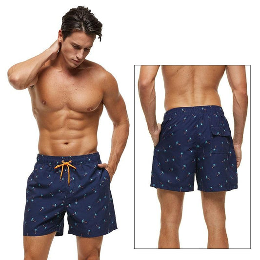 Stevvex men's navy palm-print boardshorts, quick-dry with orange drawstring and mesh lining on Tampa Home & Garden Store