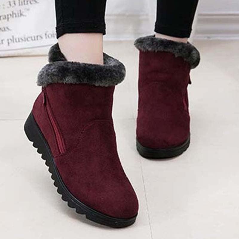 Red suede ankle boots with grey faux fur cuff, black lug sole, side zip, 2 boots on Tampa Home & Garden Store