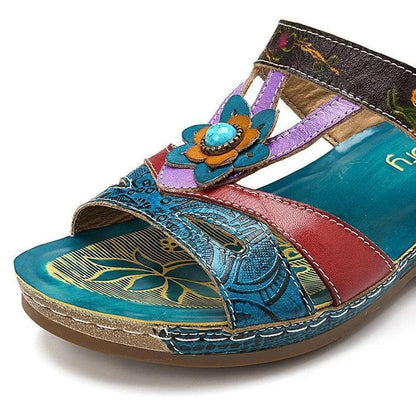 Women's sandals by Stevvex with blue floral embellishment, platform slide on Tampa Home & Garden Store