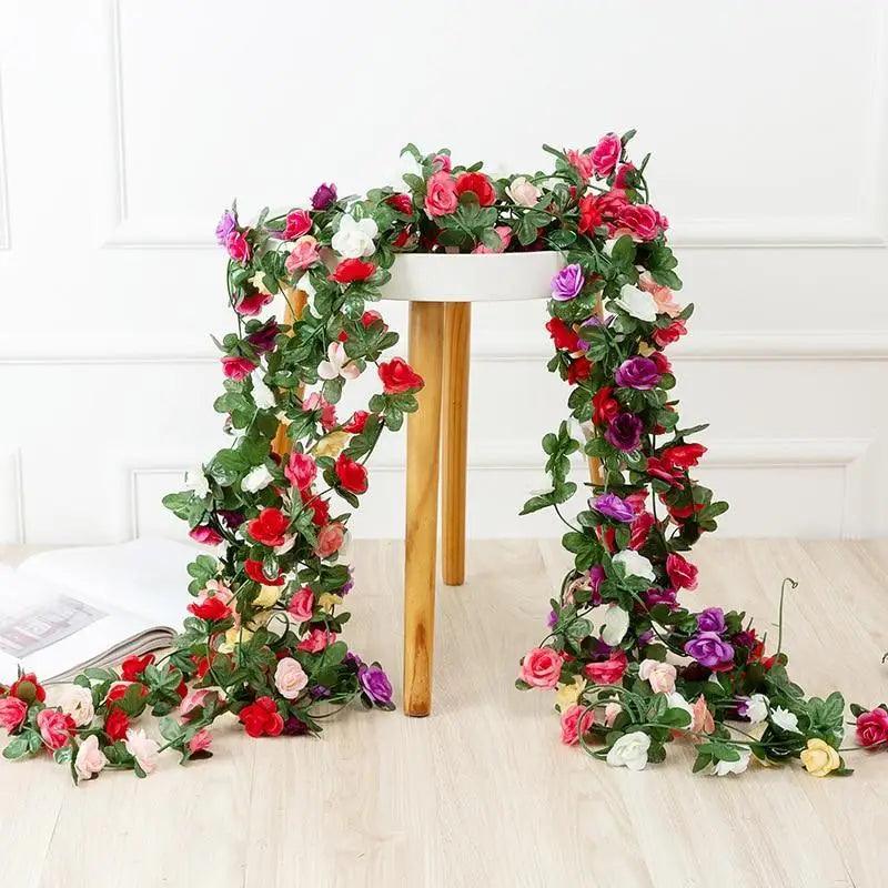 Stevvex rose garland 250cm artificial roses in pink red purple blooms, green vines on Tampa Home & Garden Store