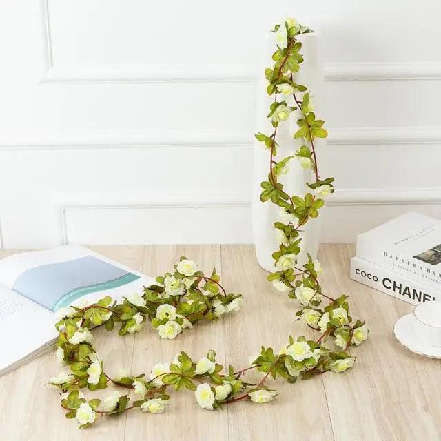 Rose artificial flower garland, 250cm, Stevvex, white blooms with green leaves for wedding decor on Tampa Home & Garden Store