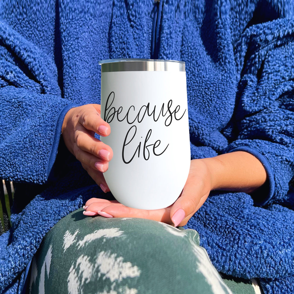 Because Life 17oz tumbler by Gia Roma, white with silver rim, held in blue fleece robe on Tampa Home & Garden Store