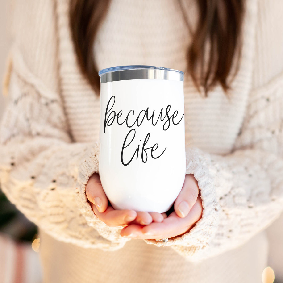 Because Life 17oz tumbler by Gia Roma in white with black script held by hands in a knit sweater on Tampa Home & Garden Store