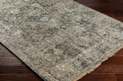 Becerril Premium Rug by Boutique Rugs in distressed gray with blue flecks and fringe on Tampa Home & Garden Store