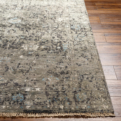 Becerril Premium Rug by Boutique Rugs, gray distressed pattern with blue flecks and fringe on Tampa Home & Garden Store