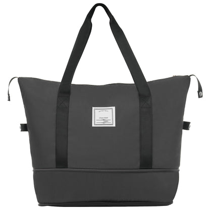 HouseOfZazla black duffel bag with wide shoulder straps and front label patch on Tampa Home & Garden Store