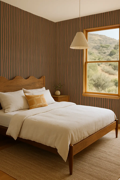 Wallpaper Dolce Stripe Terra Cotta and Olive on striped wall in a cozy wood bedroom on Tampa Home & Garden Store