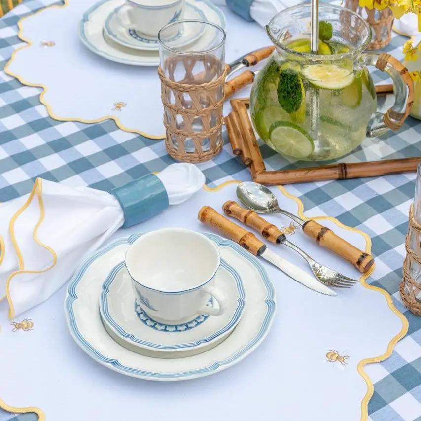 Placemat Impermeable Bumble Bee Hand Stitched by Talah; white with yellow and bee motif on Tampa Home & Garden Store