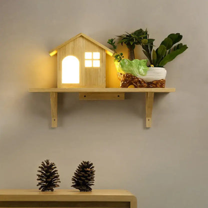 Beige wooden wall sconce featuring a lit miniature house and potted plant on natural wood shelf on Tampa Home & Garden Store