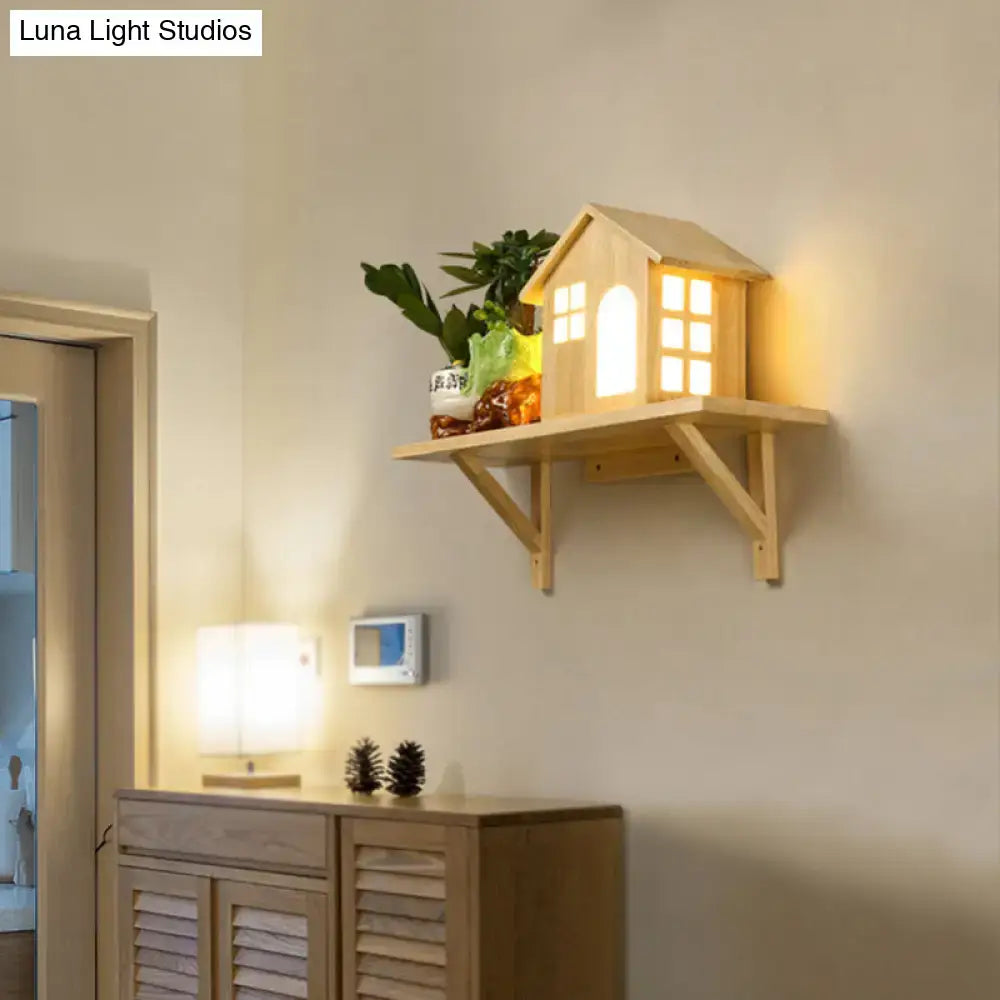 Beige wooden wall sconce with a lit miniature house lantern on a wall shelf by Decorbites on Tampa Home & Garden Store