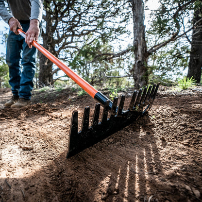 Bert rake from Backslope Tools with orange handle and black steel head used to rake soil on Tampa Home & Garden Store