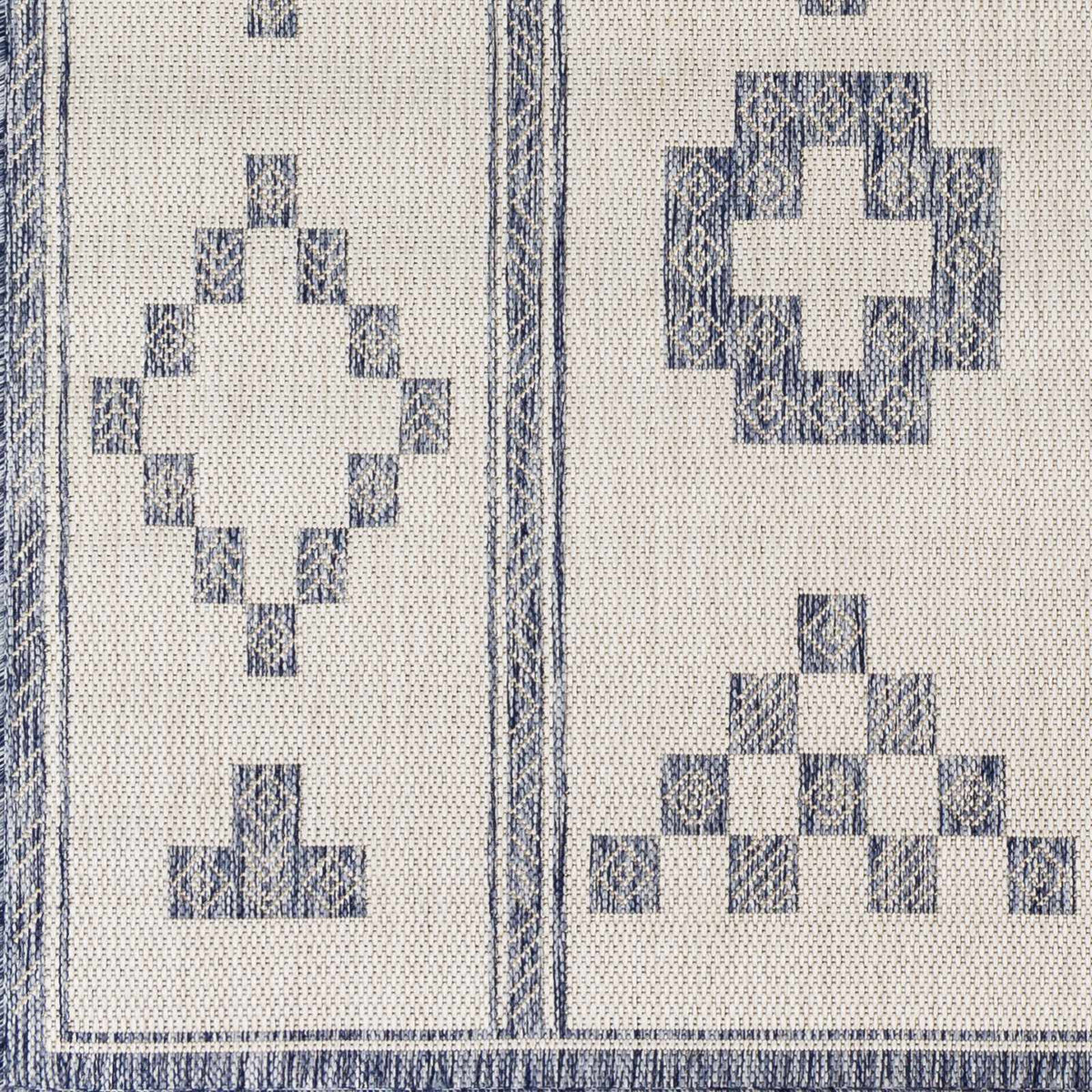 Besao Indoor & Outdoor Rug by Boutique Rugs with blue block motifs on beige ground on Tampa Home & Garden Store