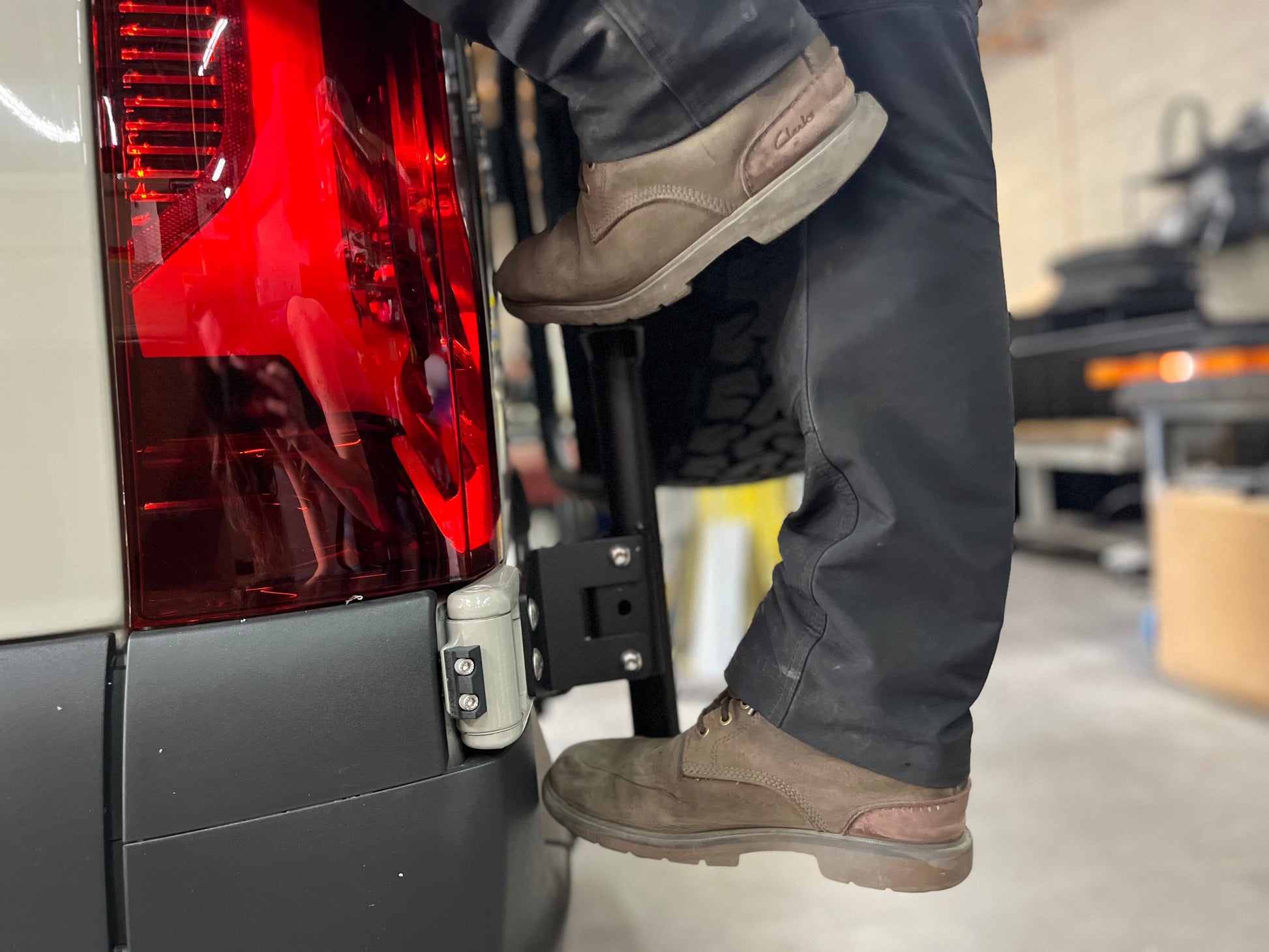 Avatar Van Rear Ladder Tire Carrier Mount in black steel on rear of van on Tampa Home & Garden Store