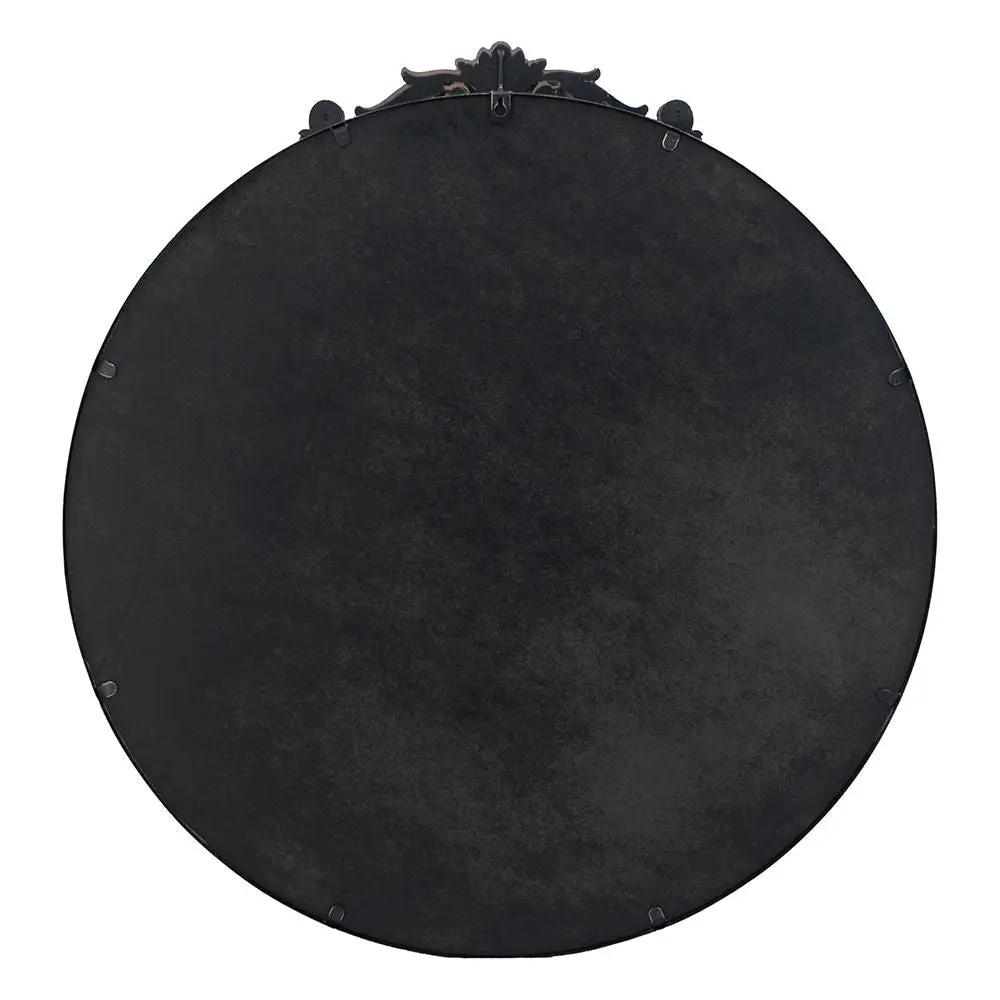 Round wall mirror back view with black patina metal and baroque crest at top on Tampa Home & Garden Store