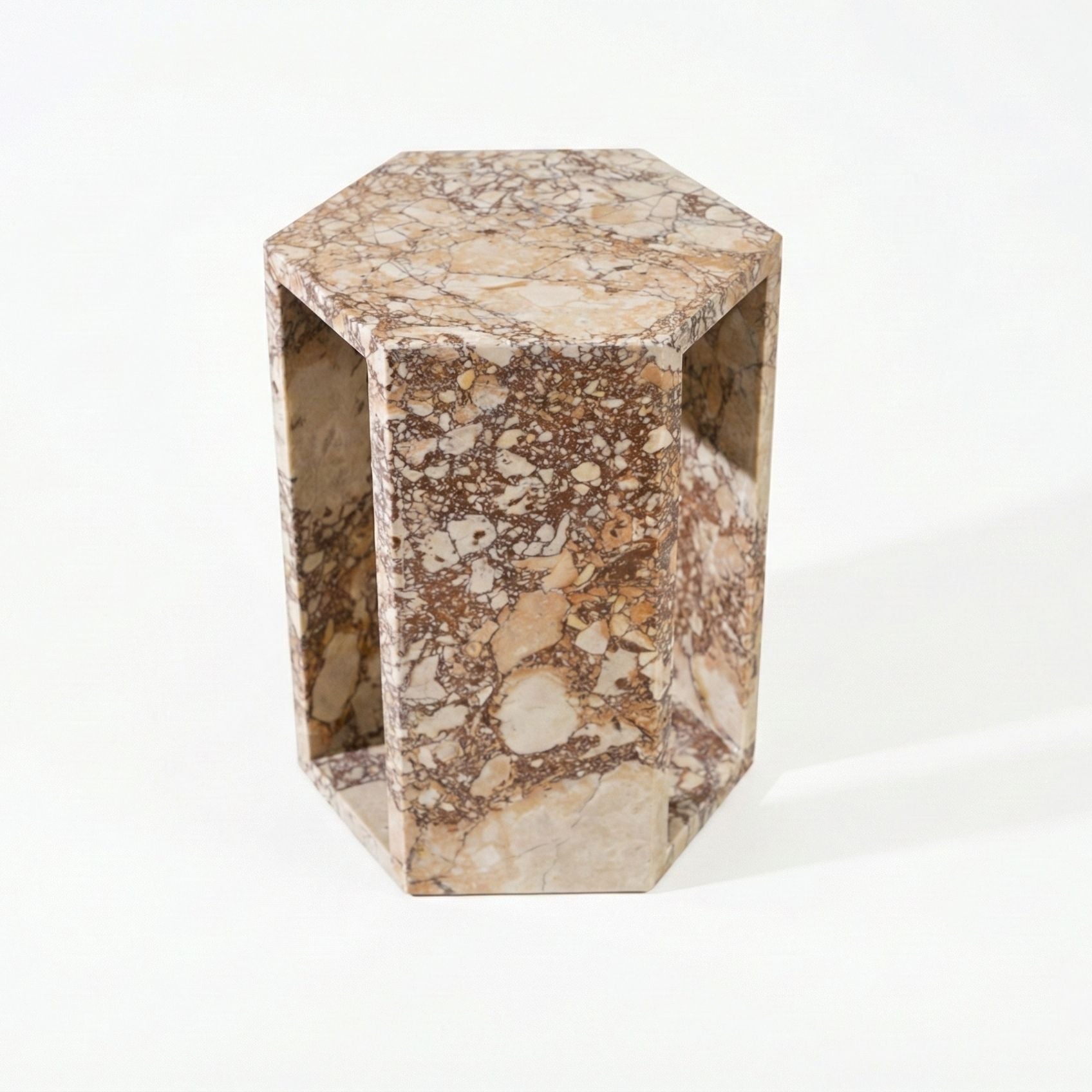 Modern hexagon side table with beige marble pattern and open rectangular side panels on Tampa Home & Garden Store