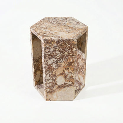 Modern hexagon side table with beige marble pattern and open rectangular side panels on Tampa Home & Garden Store