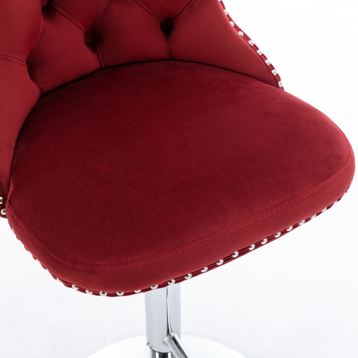 Red velvet swivel bar stool with chrome pedestal base and silver nailhead trim on Tampa Home & Garden Store
