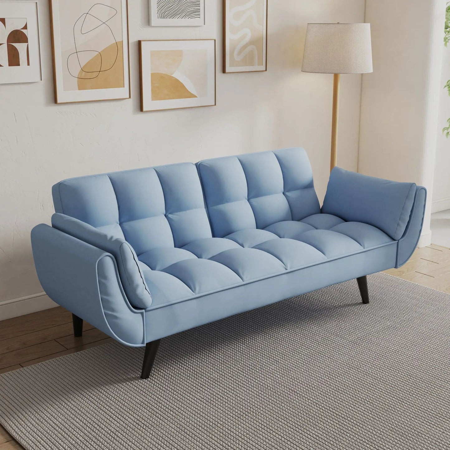 Blue futon sofa with two armrests and tufted cushions for small spaces on Tampa Home & Garden Store