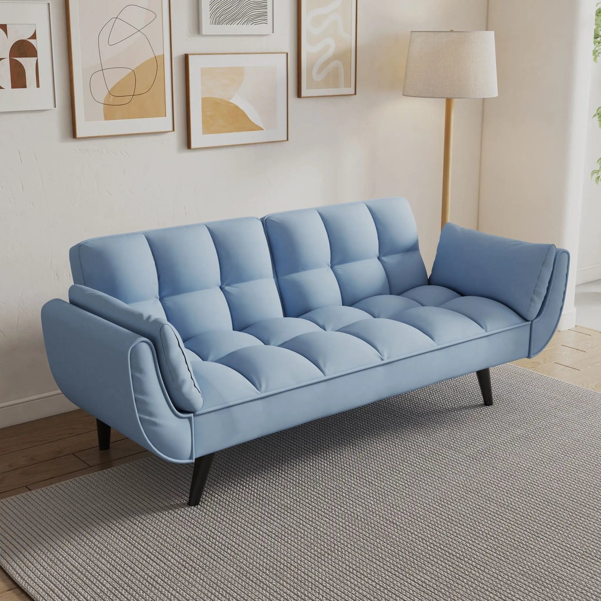 Blue futon sofa with two armrests and tufted cushions for small spaces on Tampa Home & Garden Store