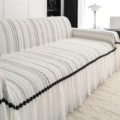 Sofa cover FLIPSTYLEZLLC with cream striped fabric, black pom-pom trim and ruffled skirt on Tampa Home & Garden Store