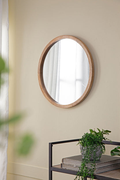 Circle wall mirror with light wooden frame on beige living room wall HouseOfZazla on Tampa Home & Garden Store