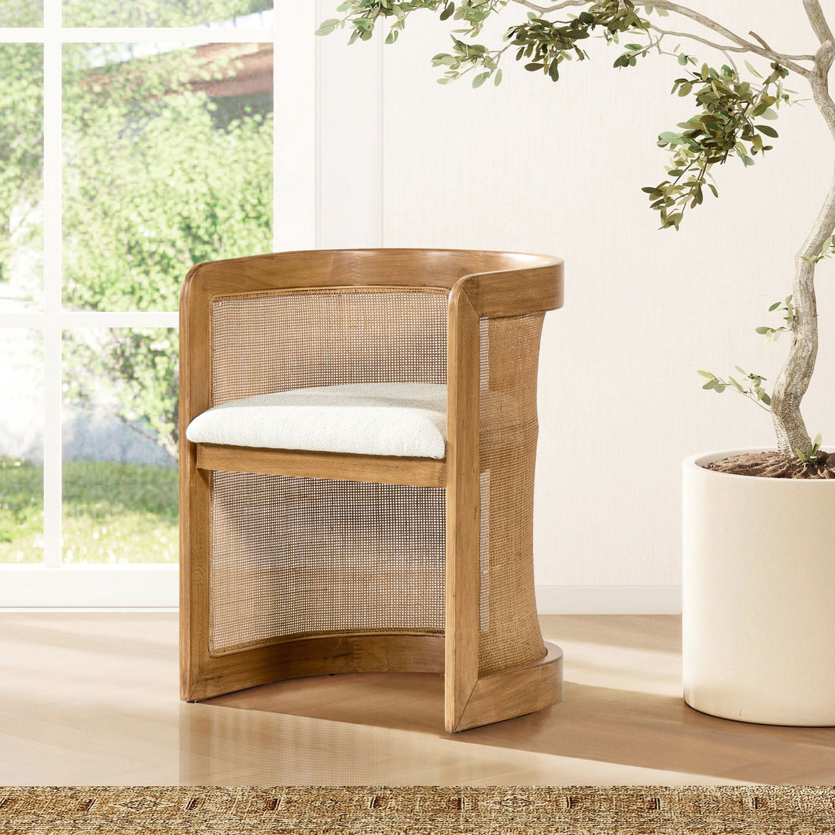 Curved upholstered dining arm chair with white pepper stain-resistant fabric and cane back on Tampa Home & Garden Store