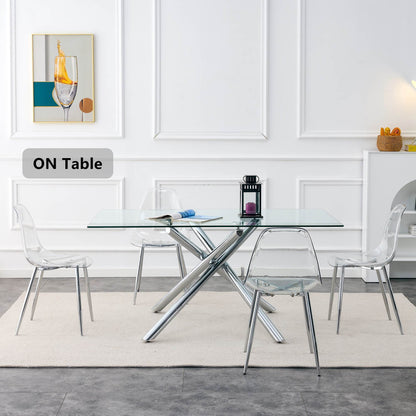 Six transparent acrylic dining chairs around a glass table in a modern minimalist set on Tampa Home & Garden Store