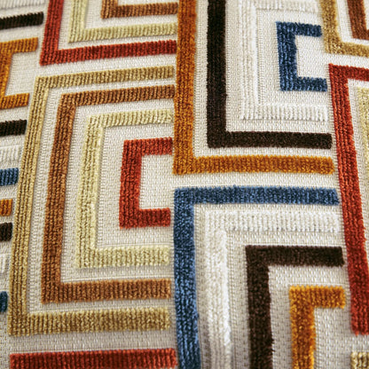 Aviemore sectional rug close-up with beige base and amber, brown, blue accents woven on Tampa Home & Garden Store