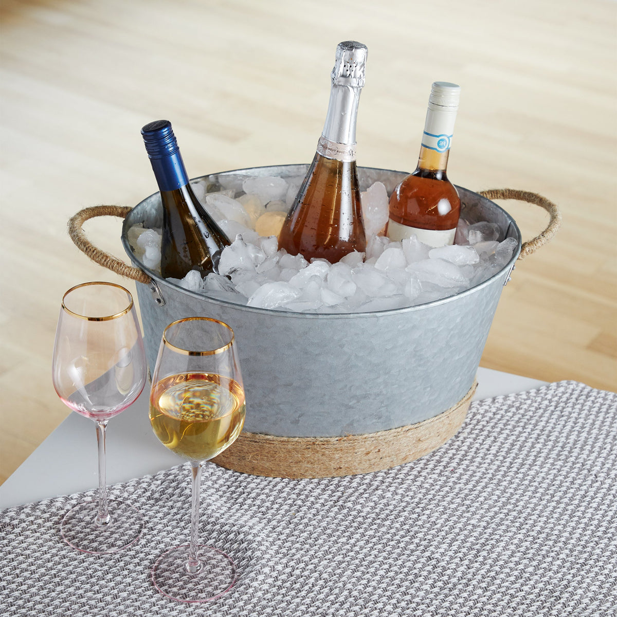 Jute rope wrapped galvanized ice bucket with ice and three wine bottles, Twine Living on Tampa Home & Garden Store