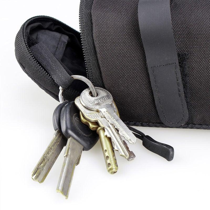 Under-seat waterproof bike bag with strap, black pouch; keys on keyring nearby on Tampa Home & Garden Store