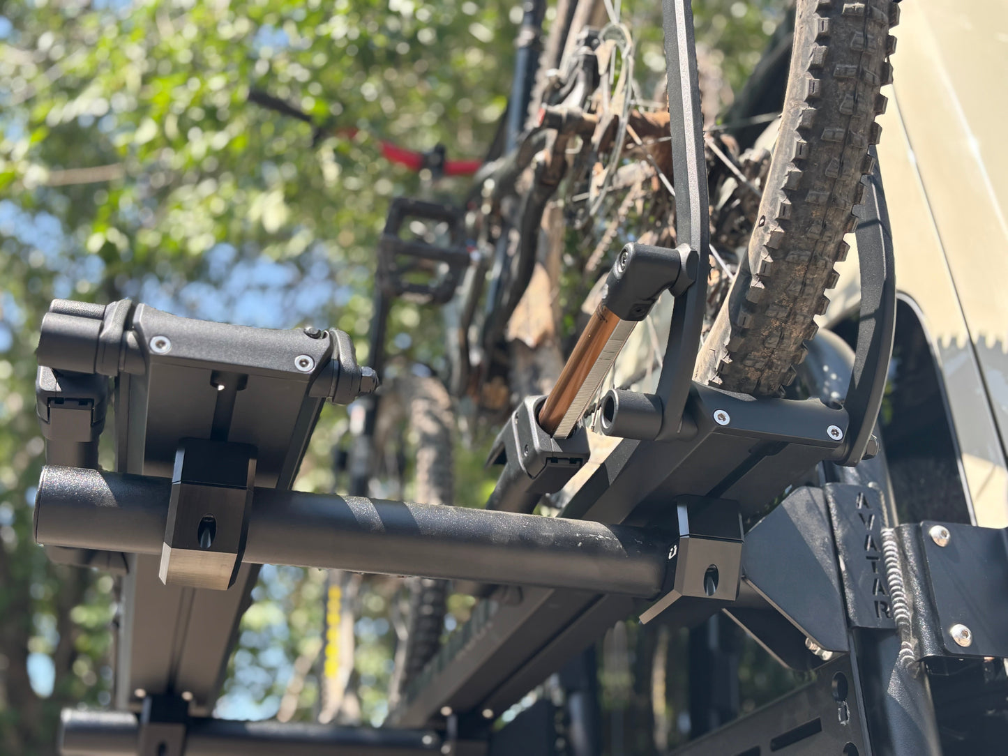 Bike Posts for Massif mount on roof rack carrying two mountain bikes; rugged black hardware on Tampa Home & Garden Store
