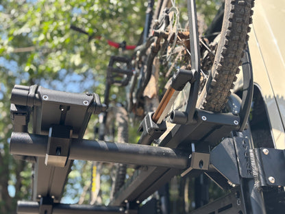 Bike Posts for Massif mount on roof rack carrying two mountain bikes; rugged black hardware on Tampa Home & Garden Store