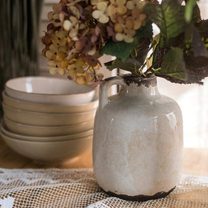 Binglie glazed pottery vase with single handle in cream glaze, with dried hydrangea on Tampa Home & Garden Store