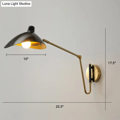 Brass adjustable wall sconce with black shade and gold interior extendable arm wall mount on Tampa Home & Garden Store
