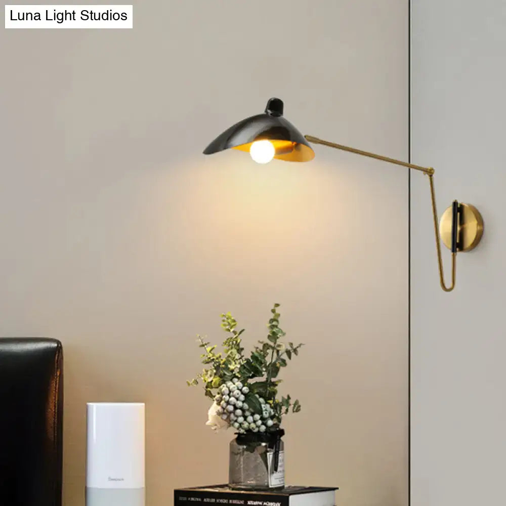 Brass Adjustable Wall Sconce with black shade and gold interior, wall-mounted on Tampa Home & Garden Store