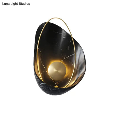 Black Marble Wall Light by Decorbites with gold ring and warm glow on Tampa Home & Garden Store