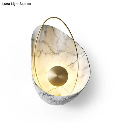 Black Marble Wall Light by Decorbites with gold brass ring and layered marble shell, warm glow on Tampa Home & Garden Store
