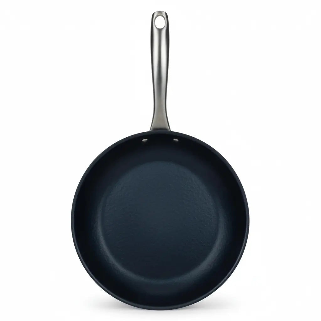 Carbon steel frying pan with dark blue interior and long metal handle on Tampa Home & Garden Store
