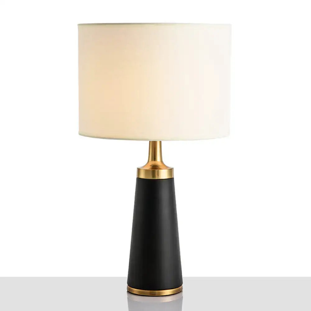 Gold Drum LED Table Lamp by Decorbites with black tapered base and ivory shade on Tampa Home & Garden Store