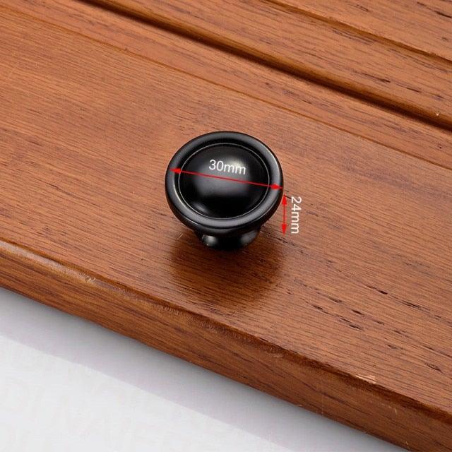 Stevvex black circular cabinet knob, 30mm diameter brushed finish for kitchen cabinets on Tampa Home & Garden Store