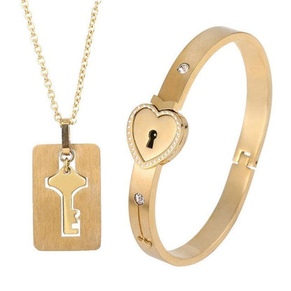 Gold-tone heart lock bracelet with crystal accents and matching gold key pendant necklace set on Tampa Home & Garden Store