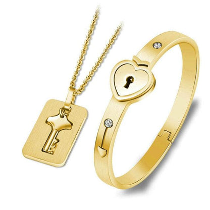 Gold-tone heart lock bracelet with crystal accents and matching key pendant necklace set on Tampa Home & Garden Store