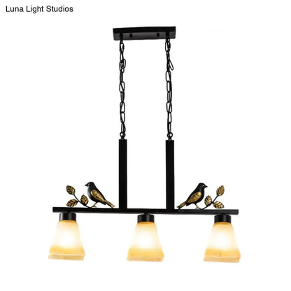 Decorbites 3-light island pendant, black & gold frame, tan glass shades, bird accents on Tampa Home & Garden Store