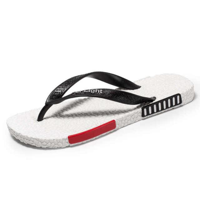 Stevvex men's black flip flop sandals with white textured footbed and red side stripe on sole on Tampa Home & Garden Store