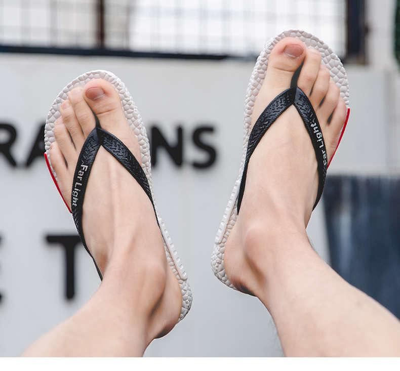 Stevvex men's black flip flop sandals with white textured sole and branded black straps on Tampa Home & Garden Store