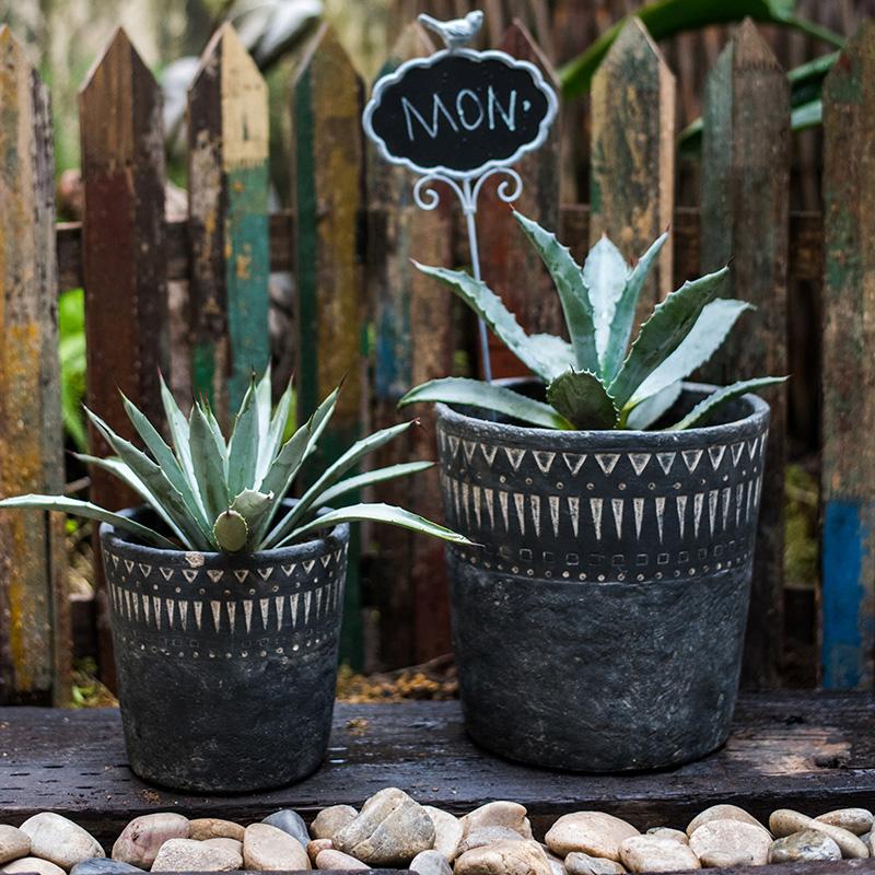Black pottery cement planters by RusticReach, two planters with white patterns and succulents on Tampa Home & Garden Store