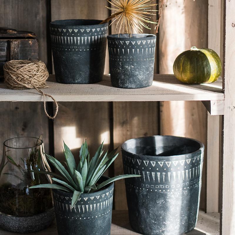 Black pottery cement planters by RusticReach with white geometric patterns, set of four on Tampa Home & Garden Store